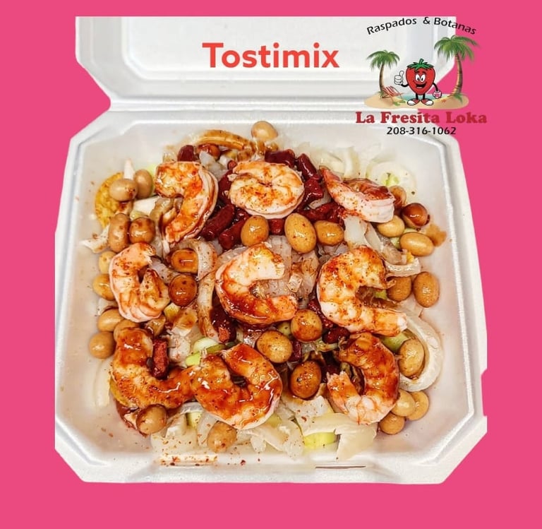Container of Tostimix shrimp and beans dish from La Fresita Loka restaurant on pink background