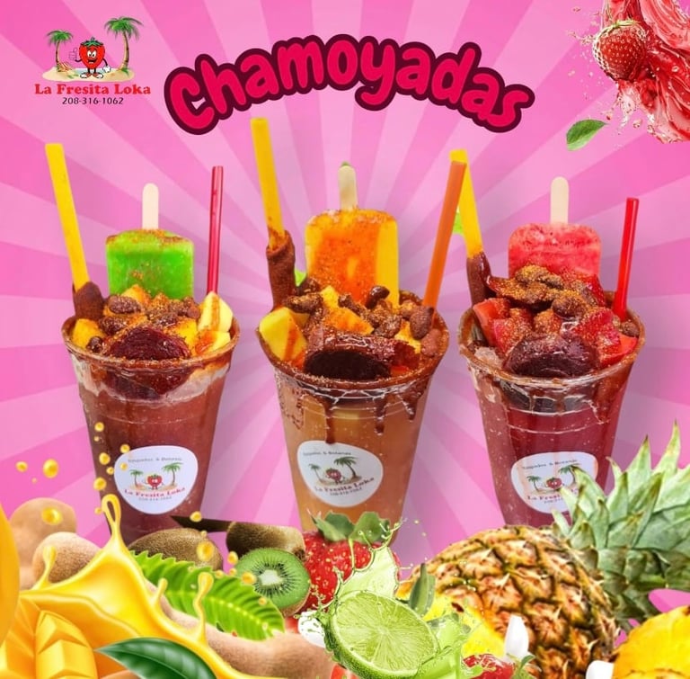 Three colorful chamoyada drinks with garnishes and straws on a pink background, surrounded by fresh fruits and the La Fresita Loka logo